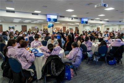 tables of people seated in Grand River Room